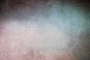 pastel colored grungy backdrop with spotlight