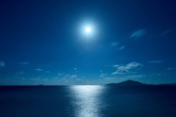 Fototapeta na wymiar Moonlight illuminating the sea