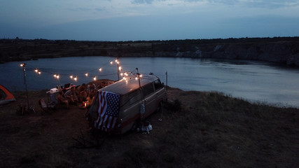 Friends Having Rest in Campsite Having Drinks
