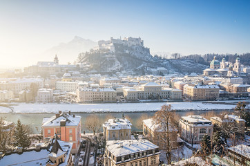 Classic view of the historic city of Salzburg with famous Hohensalzburg Fortress and Salzach river...