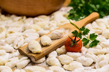 Fototapeta na wymiar Homemade gnocchi, prepared on the table with ingredients.