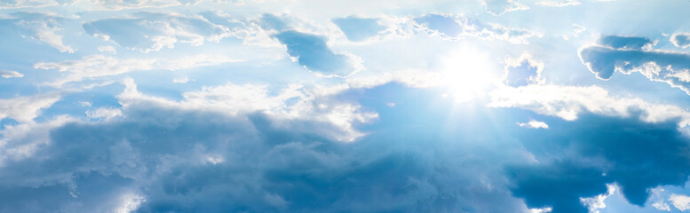 Beautiful blue sky with white clouds and sun