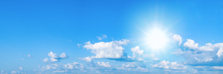 Beautiful blue sky with white clouds and sun