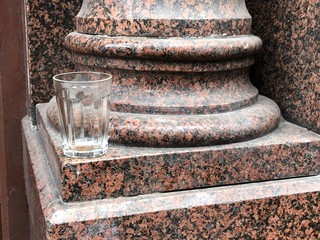 faceted glass on a column