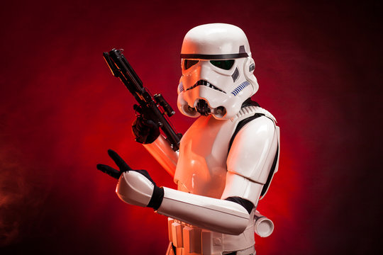 SAN BENEDETTO DEL TRONTO, ITALY. NOVEMBER 11, 2017. Close up studio portrait  of stormtrooper costume replica, with V sign hand. He is a fictional character of Star Wars saga. 