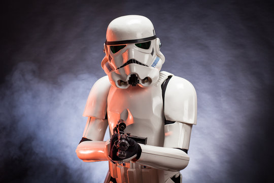 SAN BENEDETTO DEL TRONTO, ITALY. NOVEMBER 11, 2017. Studio portrait  of stormtrooper costume replica, with blaster E-11 gun. He is a fictional character of Star Wars saga. Black background 