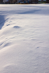 many tracks on the glade covered with snow, paths in the snow, snow-covered meadow