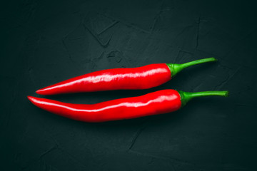 Red hot chili peppers on a dark background