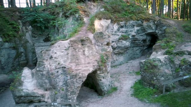 Devil's Oven or Large Ellite Natural Geological Monument  Located in the Gauja National Park at Lode Behind Cesis in Latvia. Licu  Langu Sandstone Cliffs Liepa Cave. Aerial Dron Shoot.
