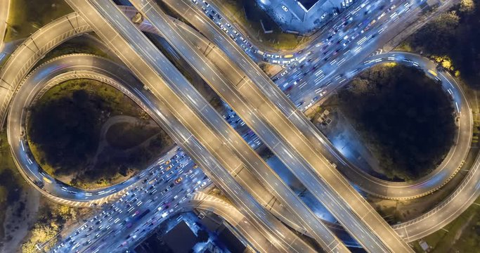 aerial top view traffic road roundabout in city at night, Time lapse top road in bangkok.