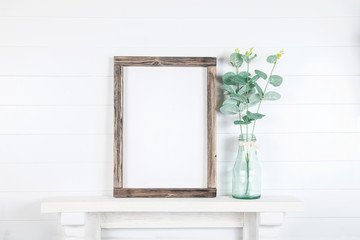 Mockup of a rough wooden frame on a white wall background in the interior - obrazy, fototapety, plakaty
