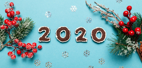 Fototapeta na wymiar New Year and Christmas chocolate gingerbread cookies in silhouette of 2020. Homemade delicious bakery, sweet family time and traditions.