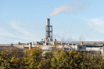 Fototapeta na wymiar oil or gas refinery smoking chimney 