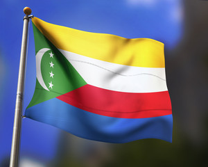 Comoros flag waving in blue sky