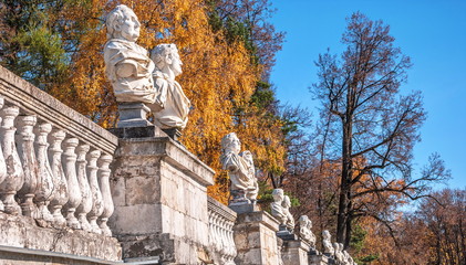 Antique busts of ancient Roman philosophers and emperors on  old terrace of  autumn park