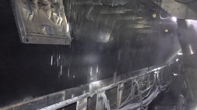 Underground coal mining. The work of the harvester in the longwall.