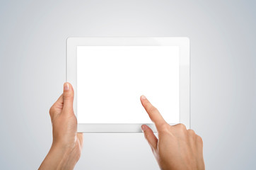 Tablet PC with white screen in women's hands.