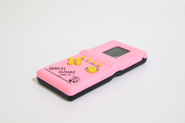 electronic portable game console tetris,Tetris game on white background,retro game,vintage game kid © Anlomaja