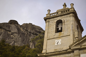 Obraz premium The bell tower in the mountains, in the background Rocky Mountain. Geres. Portugal. Europe