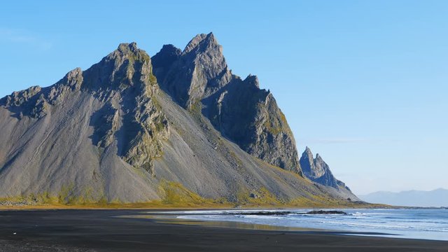 Epic view of the landscape of the black sand beach in Stokksnes. Vestrahorn mountain in the background. Nature and ecology concept background.