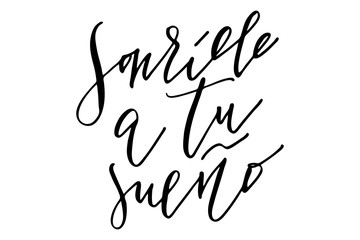 Phrase spanish writing lettering smile to your dream handwritten text vector.