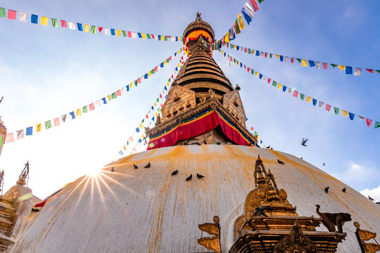 Swayambhunath Stupa, aka The Monkey Temple, during sunrise in Kathmandu, Nepal. A UNESCO Heritage Site. Ancient ruins and stone temples.