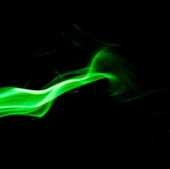 Green smoke on black background