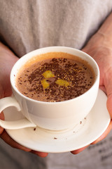 a cup of hot chocolate with chocolate chips and orange zest