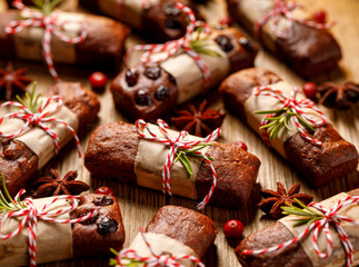 Christmas gingerbread cookies (mini loaves) on a wooden background, close-up. Delicious dessert and christmas gift