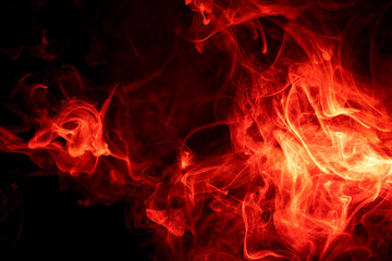 Red smoke on black background