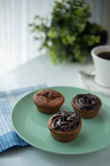 Chocolate muffin with coffee for breakfast