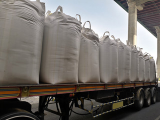 Trailer loading goods fertilizer urea sack jumbo to customers. 