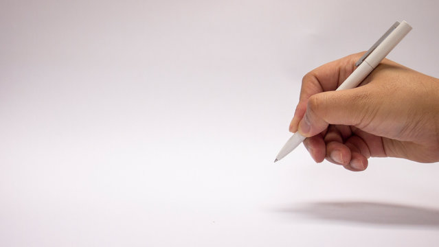 right hand is writing on white background, clear screen for drawing, space area for new concept, Please fill in personal data, complete an application form, put down one's name