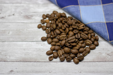 coffee with coffee beans on wooden table background