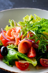 Smoked salmon salad in dash close up.