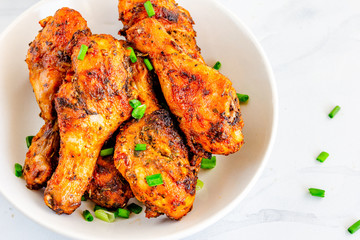 Baked Chicken Drumsticks in a Bowl Close Up Photo.ROasted Chicken Legs Photo.