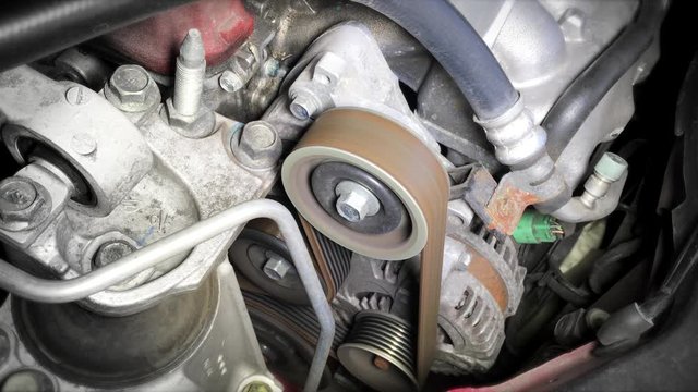 fan belt of a running engine car
