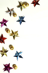 Christmas composition. Colorful stars decorations on white background. Christmas, winter, new year concept. copy space