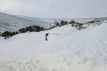 Traffic sign buried by the snow