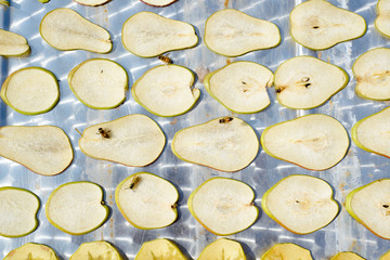 the process of drying apples and pears. harvesting of dried fruits for the winter