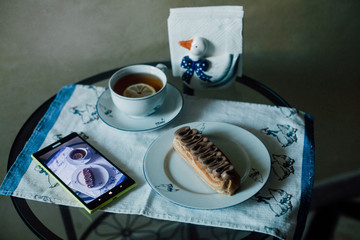 Sweet handmade eclair at the table