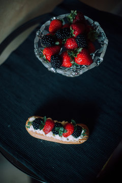 Sweet handmade eclair at the table