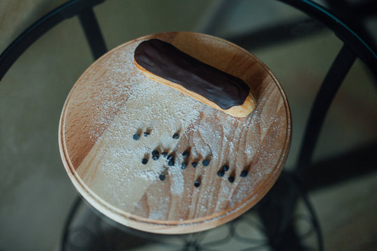 Sweet handmade eclair at the table
