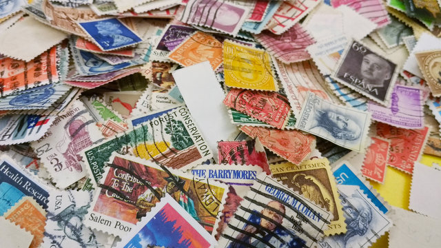 A lot of old used postmarks, post stamps on the table. Washington post museum. USA