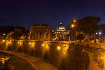 Fototapeta na wymiar Roma by night with St. Peter Church far behind.