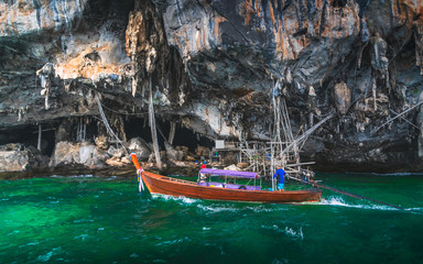 Fototapeta na wymiar Beautiful nature scenic landscape of Viking cave with boat for traveler Phi Phi island Krabi Adventure lifestyle travel Phuket Thailand Tourist on holiday vacation trips Tourism destination place Asia