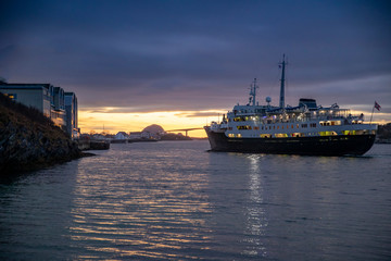 Obraz premium Coastal passenger ships arrive at Brønnøysund port in northern Norway