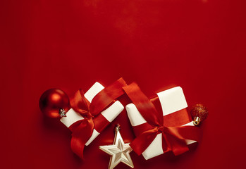 Christmas card with gifts on a red background. with a place for congratulations.