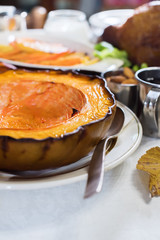 Pie baked pumpkin setting table on Thanksgiving