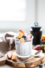 Chia pudding with fresh berries in glass jar. Concept of healthy eating, healthy lifestyle,...